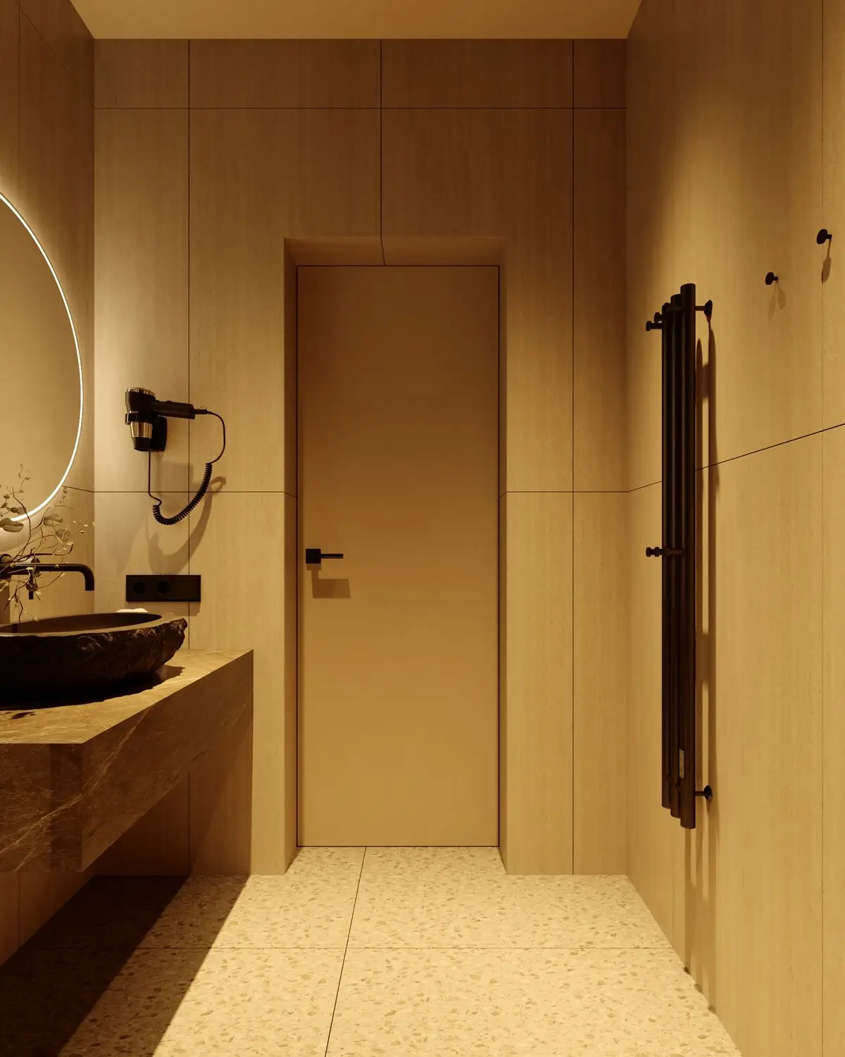 Bathroom door, stone sink, and heated towel rail