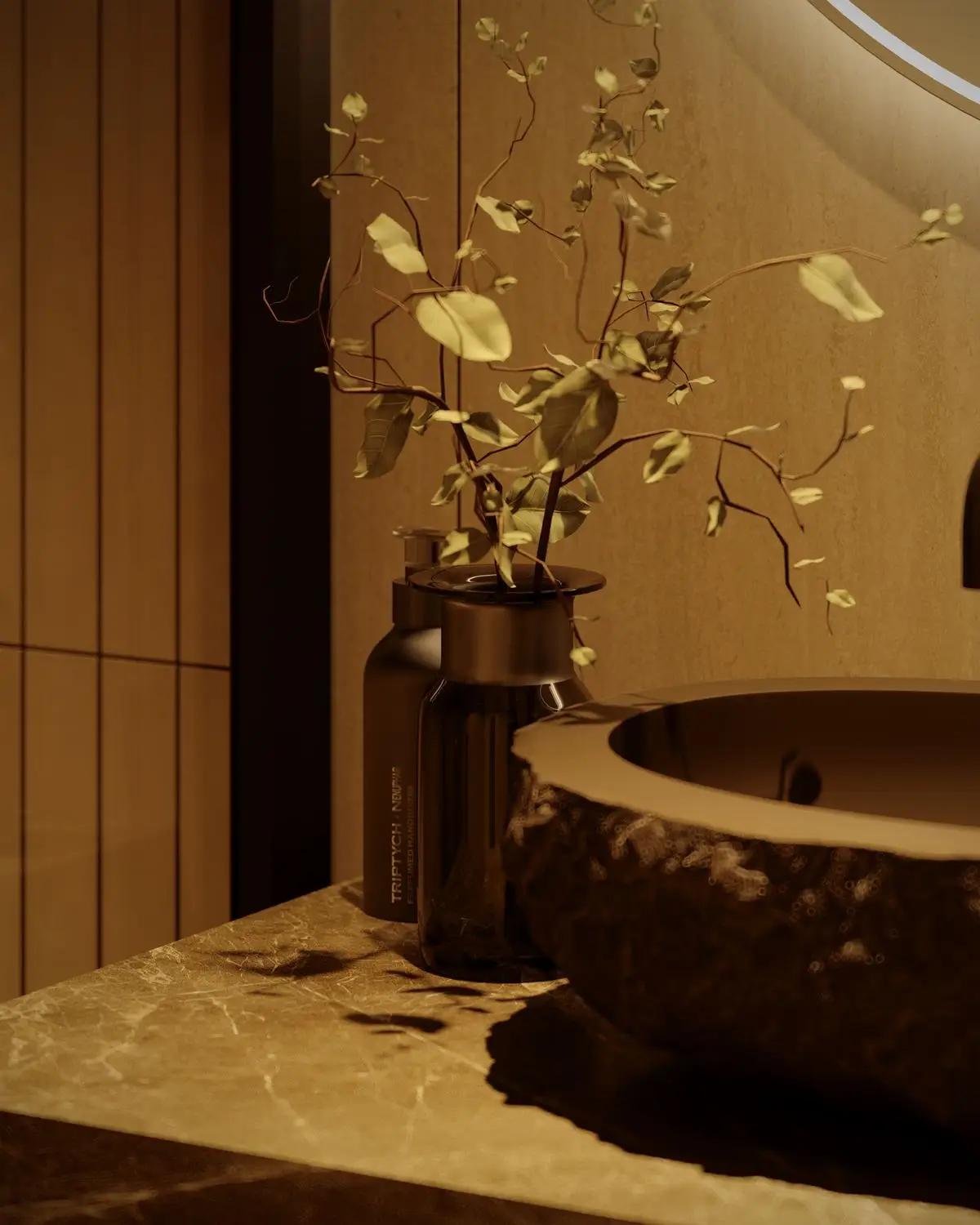 Raw stone sink with a branch and bottles