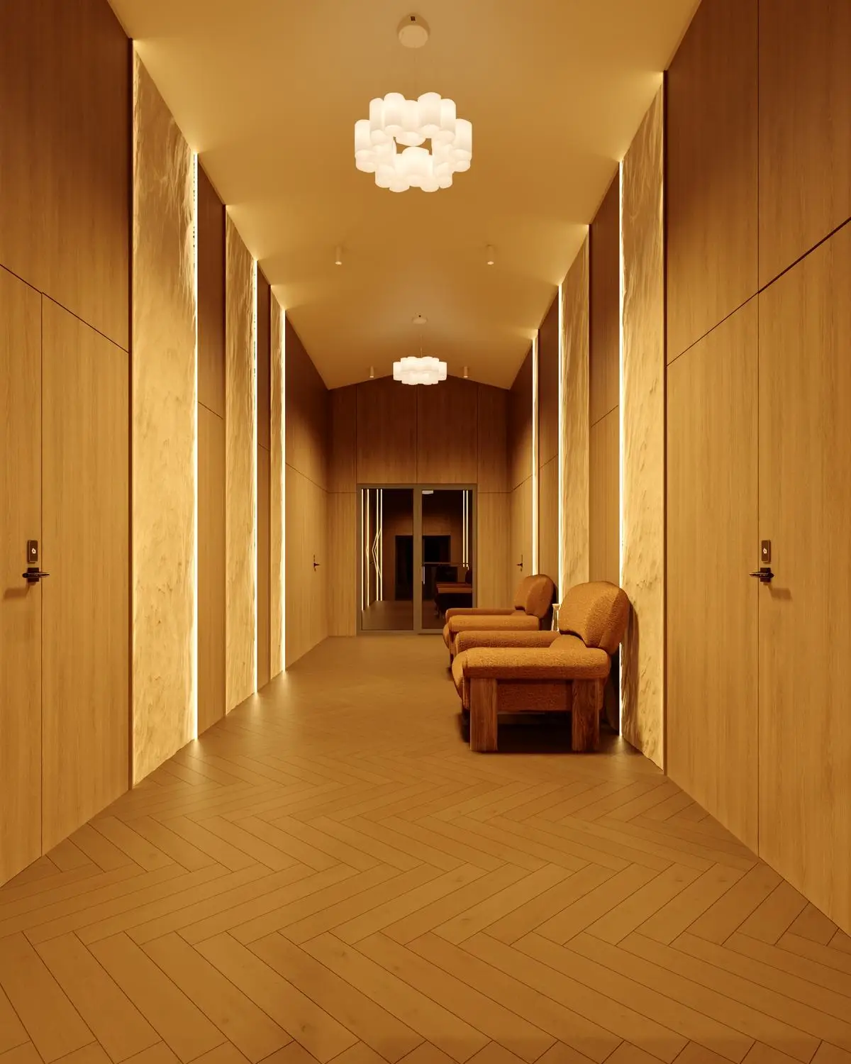 Corridor with armchairs by a mirrored door at the end